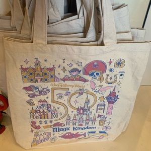 The Magic Kingdom bag features imagery of rides and celebrations of the 50th
